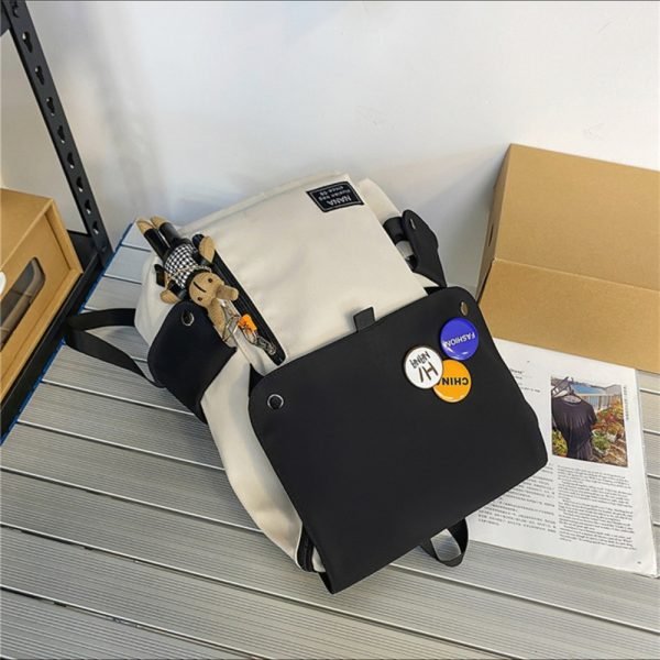 white capacity backpack lay