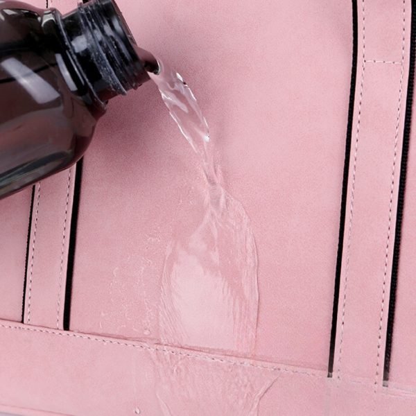 Pink suede laptop pouch water