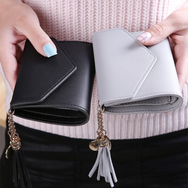 grey and black tassel wallet